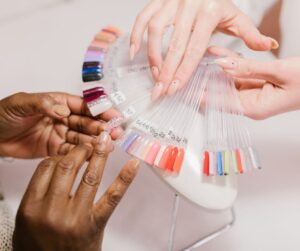 DIY Nails at home - A professional offering a selection of colours to a client