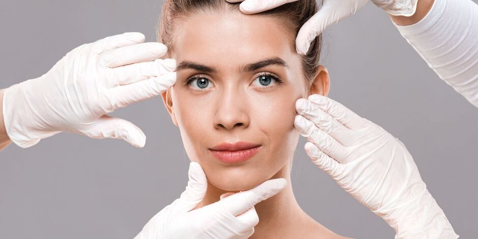 Transform Your Look with Nail Divas Beauty Clinic, Whitchurch Cardiff. Image shows a model surrounded by gloved hands about to perform treatments